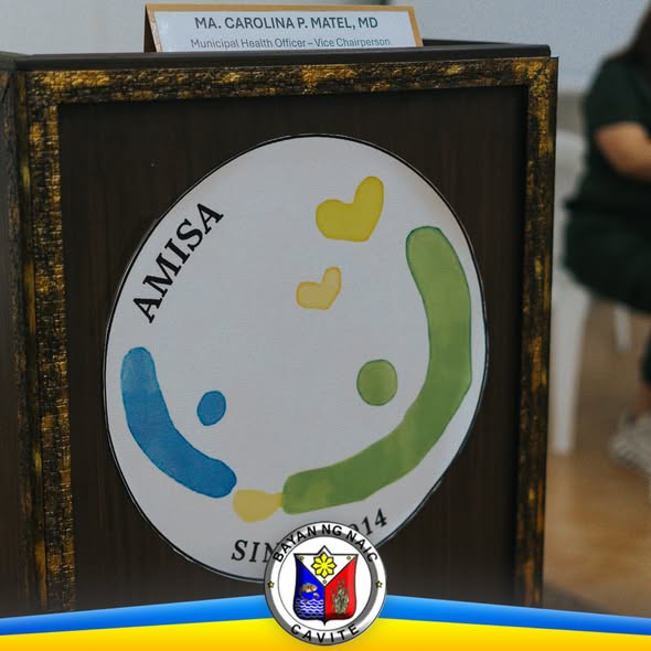 Podium na may logo ng AMISA at pangalan ng Municipal Health Officer, sa Naic Local Health Board meeting
