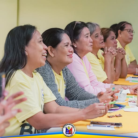Mga BNS na nakaupo sa mesa habang nakikinig sa 3 Day BNS Refresher and Enhancement Skills Training sa Naic