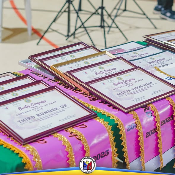 Mga certificate at ribbon ng Buntis Congress 2025 na nakalatag sa mesa, kabilang ang Best in Denim Wear at Third Runner-Up