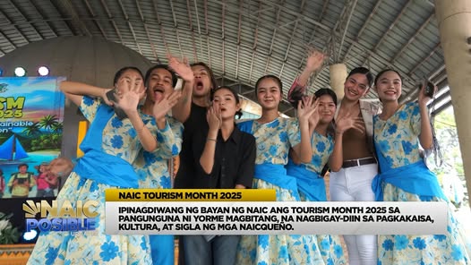 Mga performer na naka-floral na kasuotan habang kumakaway sa Tourism Month 2025 celebration sa Naic