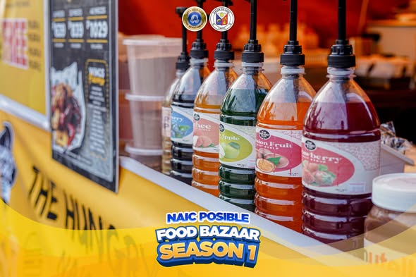 Mga bote ng flavored syrup na may pump sa food stall ng Naic Posible Food Bazaar: Season 1