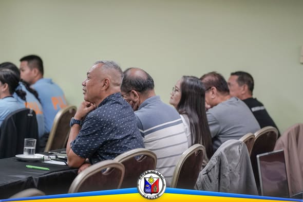 Mga kalahok sa CSAR Program habang nakikinig sa presentasyon sa loob ng hotel sa Naic