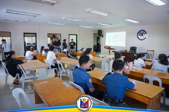 Mga dumalo sa pagpupulong ng LCAT-VAWC at LCPC sa ABC Hall, nakaupo at nakikinig sa harap ng projector