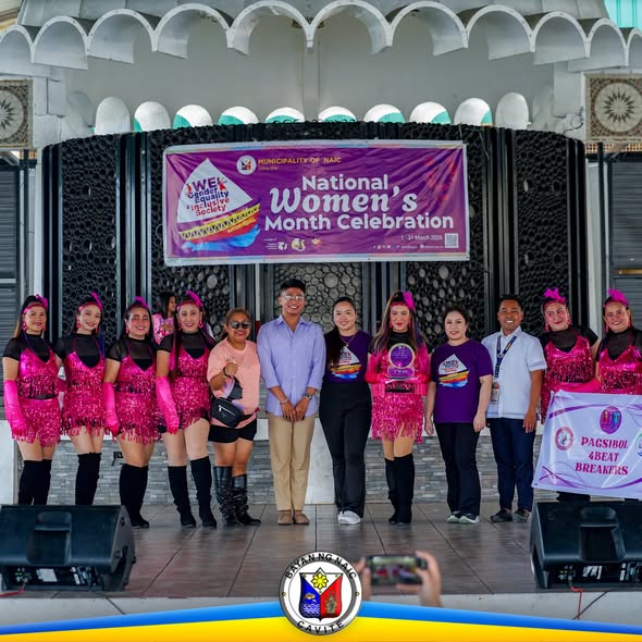 Mga performer ng Zumba at opisyal sa entablado ng Naic Town Plaza para sa National Women's Month Celebration