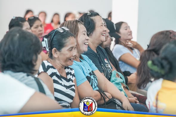 Mga dumalo sa Financial Literacy Training na nakangiti at tumatawa sa Triple 8, Sabang, Naic