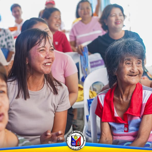 Mga miyembro ng kooperatiba na nakangiti habang nakikinig sa 31st General Assembly sa Palangue