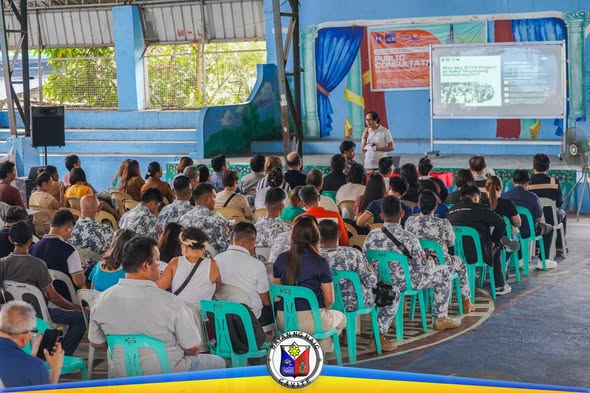 Mga dumalo sa Public Consultation ng BCIB Project habang nakikinig sa presentasyon sa covered court ng Brgy. Timalan…