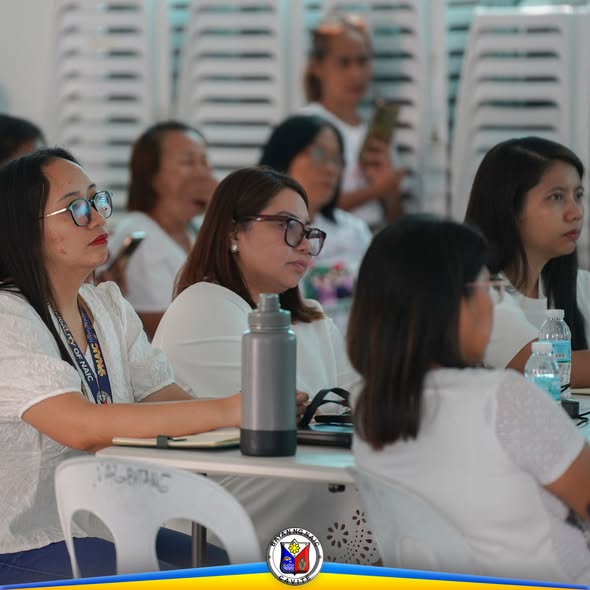 Mga kalahok na nakaupo at nakikinig sa programang Recovery and Rehabilitation sa Triple 8 Hall, Sabang, Naic