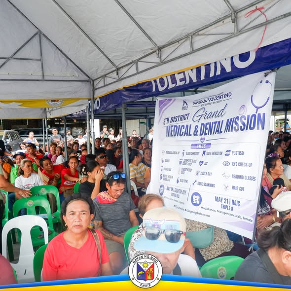 Poster: 8th District Grand Medical and Dental Mission, Mayo 21, Naic Triple 8; maraming tao ang nakaupo sa ilalim ng tent