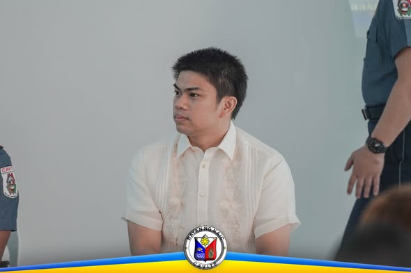 Lalaking naka-barong habang nakaupo sa programa ng PCR Month sa Brgy. Sabang, Naic