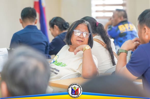 Mga dumalo sa IEC Campaign para sa Fisherfolk na nakaupo at nakikinig sa loob ng Liga ng mga Barangay Building