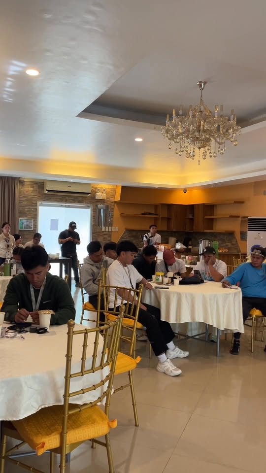 Mga kalahok sa Basic Life Support Training na nakaupo sa mga mesa sa Torres Farm Hotel, Barangay Sabang, Naic
