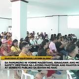 Mga tao na nakaupo sa seminar hall habang nakikinig sa pulong para sa kaligtasan at pamamahala sa Naic