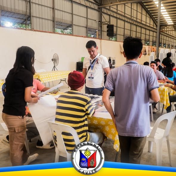 Mga kalahok at kawani sa pagpupulong ng PALIGID Program sa loob ng hall sa Naic